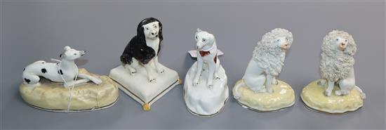 A pair of Samuel Alcock figures of seated poodles and three other Alcock type figures of dogs, c. 1840-50, H. 7cm -9cm (5)
